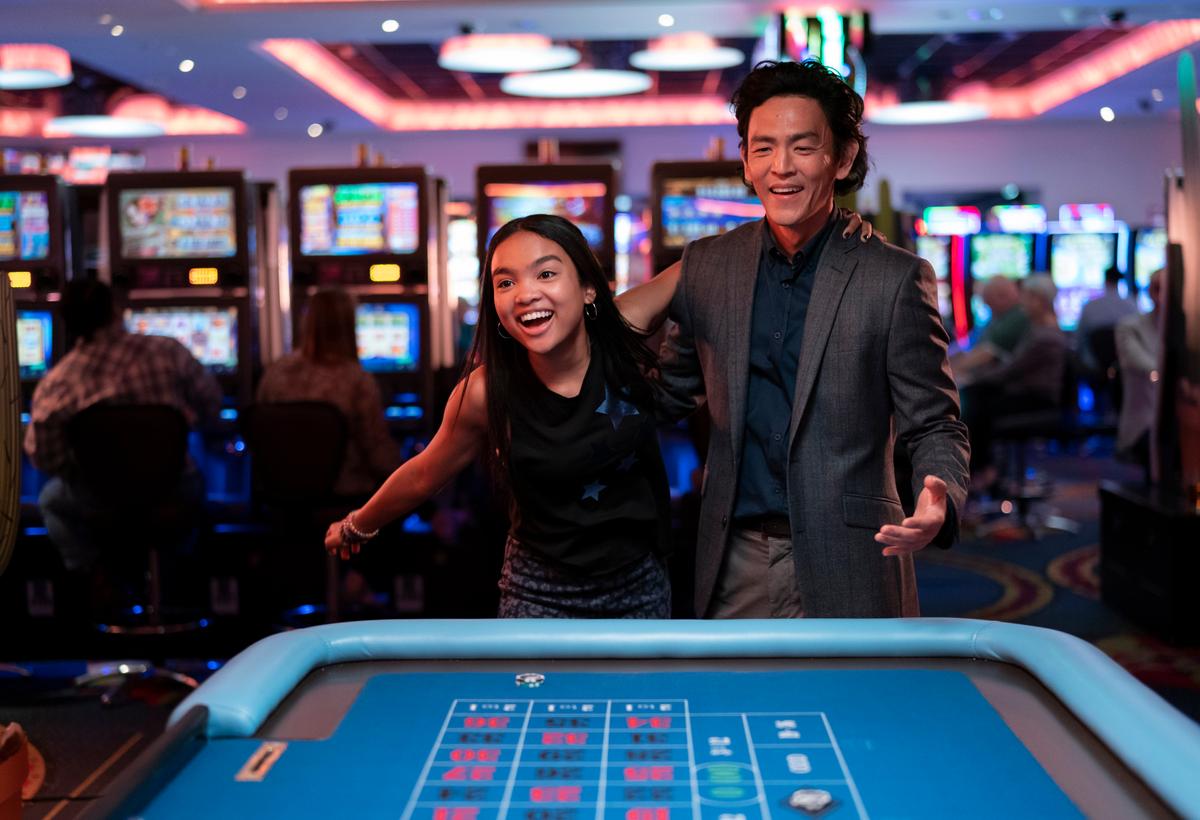 Wally (Mia Isaac) and Max (John Cho) do a bit of gambling in "Don't Make Me Go." (Amazon Studios)
