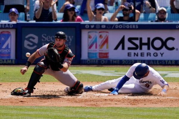 Los Angeles Dodgers' Gavin Lux, right, scores on a double by Max Muncy as San Francisco Giants catcher Joey Bart takes a late throw during the third inning of a baseball game at Dodger Stadium, in Los Angeles, on Sunday, July 24, 2022. (Mark J. Terrill/AP Photo)