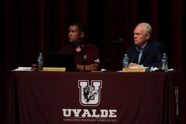 Uvalde Consolidated Independent School District Board President Luis Fernandez (L) and Superintendent Hal Harrell listen to residents’ concerns at a board meeting in Uvalde, Texas, on July 18, 2022. (Charlotte Cuthbertson/The Epoch Times)