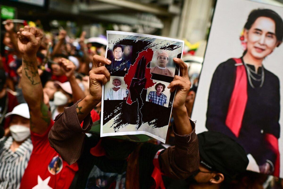 Protesters shout slogans and hold photos of executed prisoners during a demonstration against their killings by the military junta in Burma (also known as Myanmar), outside the Burmese embassy in Bangkok on July 26, 2022. (AFP via Getty Images/Manan Vatsyayana)