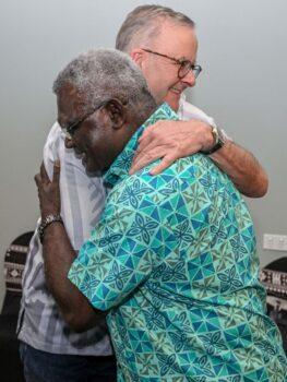 Australia's Prime Minister Anthony Albanese (L) hugs Solomon Islands Prime Minister Manasseh Sogavare as they meet for a bilateral meeting at the Pacific Islands Forum in Suva, Fiji on July 13, 2022. (Joe Armao/POOL/AFP via Getty Images)