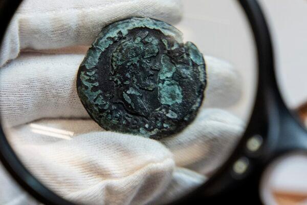 A rare, nearly 1,850-year-old bronze coin discovered off the Israeli coastal city of Haifa is on display at Israel's Antiquities Authority office in Jerusalem, on July 26, 2022. (Tsafrir Abayov/AP Photo)