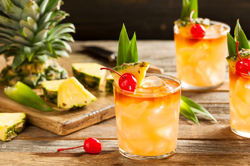 Bartenders may add sweet pineapple and orange juices, float the dark rum, and go wild with garnishes. (Brent Hofacker/Shutterstock)