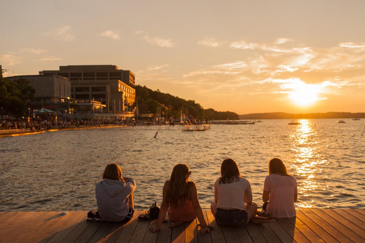 A group of friends watch the sunset on Lake Mendota. (Focal Flame Photography/Courtesy of Destination Madison)