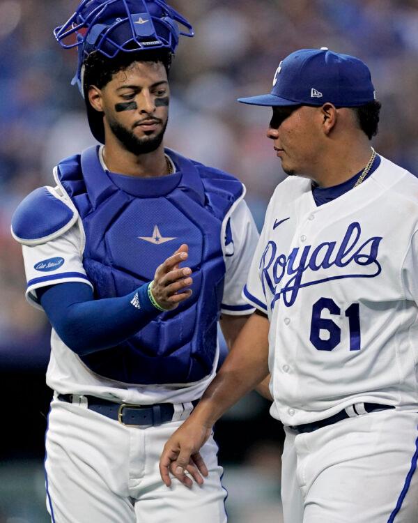 Kansas City Royals catcher MJ Melendez, left, greets starting pitcher Angel Zerpa (61) as Zerpa comes out of the game during the fifth inning of a baseball game in Kansas City, Mo., on July 26, 2022. (Charlie Riedel/AP Photo)
