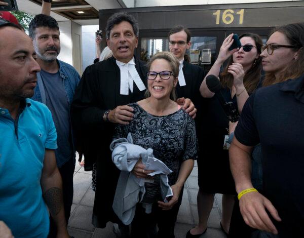 Freedom Convoy organizer Tamara Lich with her lawyer Lawrence Greenspon as she leaves court after being released on bail, in Ottawa on July 26, 2022. (Adrian Wyld/The Canadian Press)