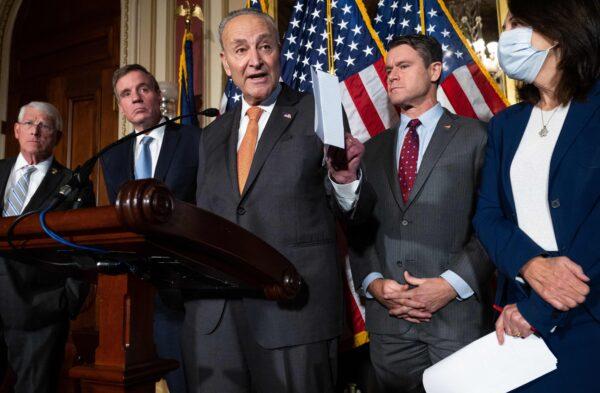 Senate Majority Leader Chuck Schumer (D-N.Y.) speaks alongside a bipartisan group of U.S. Senators, including (L-R) Roger Wicker (R-Miss.); Mark Warner (D-Va.); Todd Young (R-Ind.), and Maria Cantwell (D-Wash.), following the passage of the CHIPS Act, providing domestic semiconductor manufacturers with $52 billion in subsidies to cut reliance on foreign sourcing, at the U.S. Capitol in Washington, D.C., on July 27, 2022. (Saul Loeb/AFP via Getty Images)