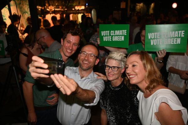 (L-R) Greens candidate for the seat of Griffith Max Chandler-Mather, party leader Adam Bandt, Queensland senate candidate Penny Allman-Payne and Queensland Senator Larissa Waters take a selfie during the Greens national campaign launch at Black Hops Brewery in Brisbane, Australia, on May 16, 2022. (Dan Peled/Getty Images)