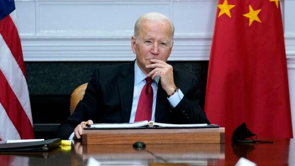 President Joe Biden listens during a virtual meeting with Chinese leader Xi Jinping in the Roosevelt Room of the White House in Washington on Nov. 15, 2021. (Susan Walsh/AP Photo)