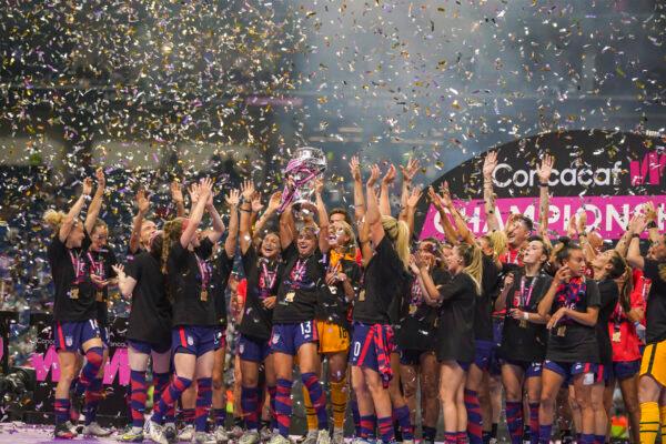 United States' players hold the trophy as they celebrate winning the CONCACAF Women's Championship final soccer match against Canada in in Monterrey, Mexico, Monday, July 18, 2022. (Fernando Llano/AP Photo)
