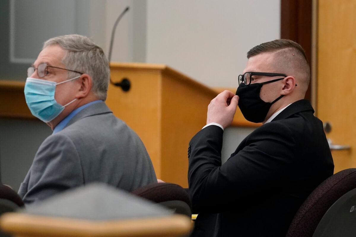 Volodymyr Zhukovskyy (R) of West Springfield, Mass., charged with negligent homicide in the deaths of seven motorcycle club members in a 2019 crash, is seated during his trial with defense attorney Steve Mirkin (L) at attorney Coos County Superior Court in Lancaster, N.H., on July 26, 2022. (Steven Senne/Pool via AP)