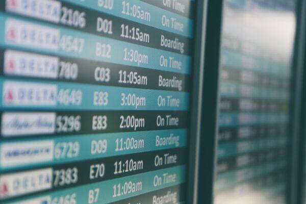 Airport information screens are showing flights being "on time" less frequently this summer. (Stock photo/Matthew Smith/Unsplash)