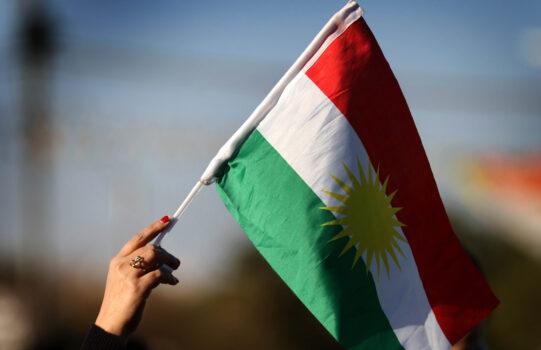 A Syrian Kurd waves the Kurdish flag in the northern Iraqi city of Erbil, the capital of the autonomous Kurdistan region, during a demonstration on Feb. 2, 2018, against the military operation by the Turkish army against the Kurdish YPG forces in Syria's Afrin. (Safin Hamed/AFP via Getty Images)