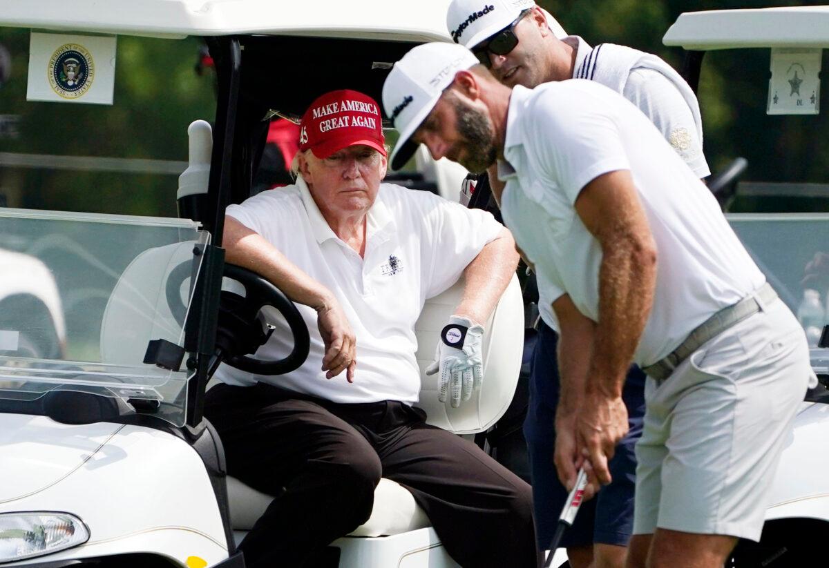 Former President Donald Trump sits in a golf cart as he watches Dustin Johnson putt during the pro-am round of the LIV Golf Invitational Bedminster at Trump National Golf Club Bedminster in N.J. on July 28, 2022. (Seth Wenig/AP Photo)