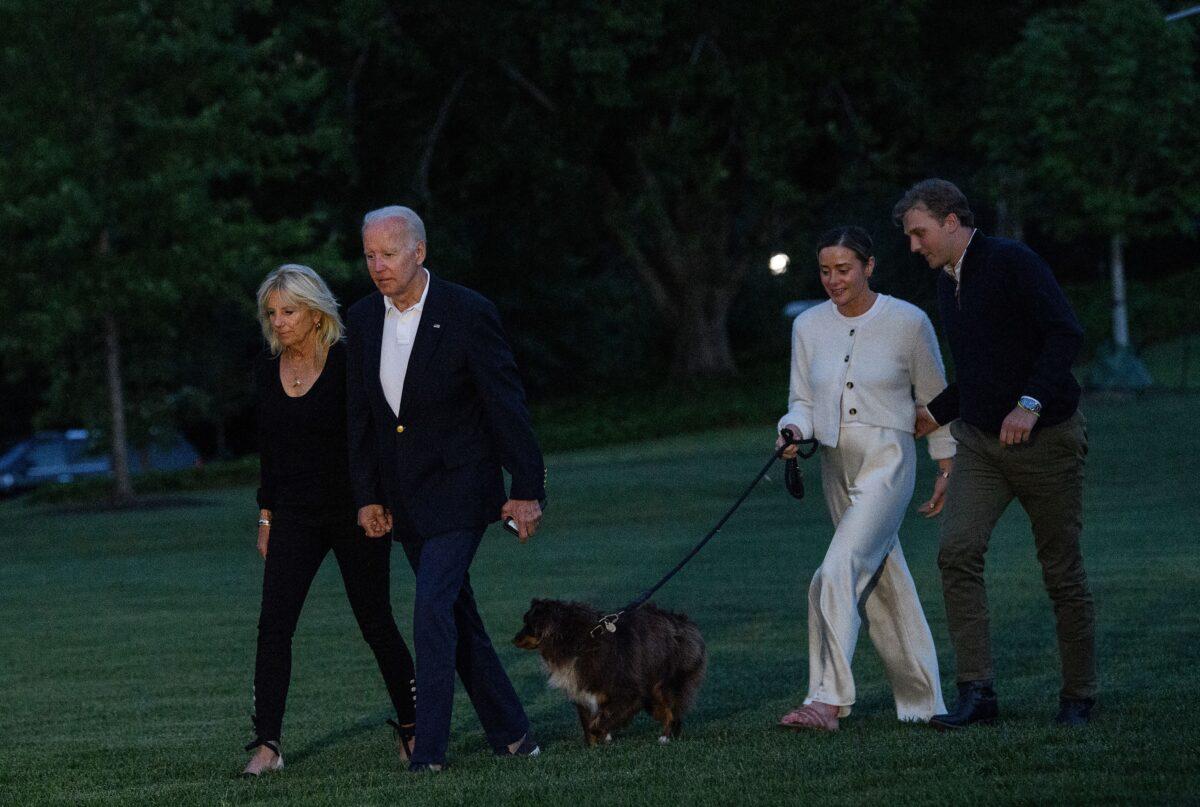 President Joe Biden, First Lady Jill Biden, their granddaughter Naomi Biden, and her fiance Peter Neal walk to the White House on June 20, 2022. (Nicholas Kamm/AFP via Getty Images)
