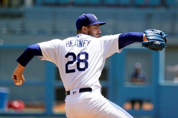 Los Angeles Dodgers starter Andrew Heaney throws to a Washington Nationals batter during the first inning of a baseball game at Dodger Stadium, in Los Angeles, on July 27, 2022. (Marcio Jose Sanchez/AP Photo)