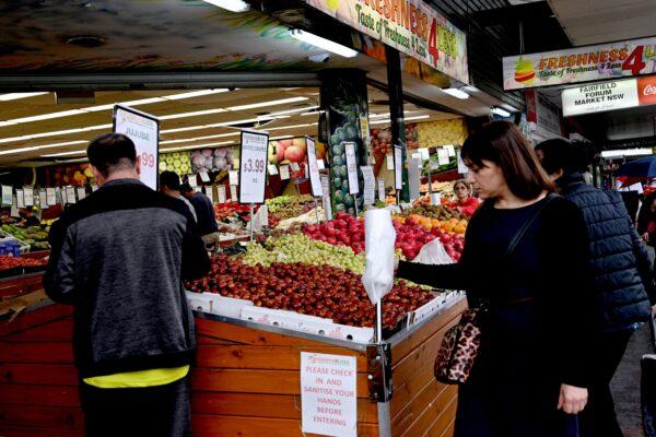 People shop at a market in a suburb of western Sydney in Sydney, Australia, on April 27, 2022. (Saeed Khan/AFP via Getty Images)