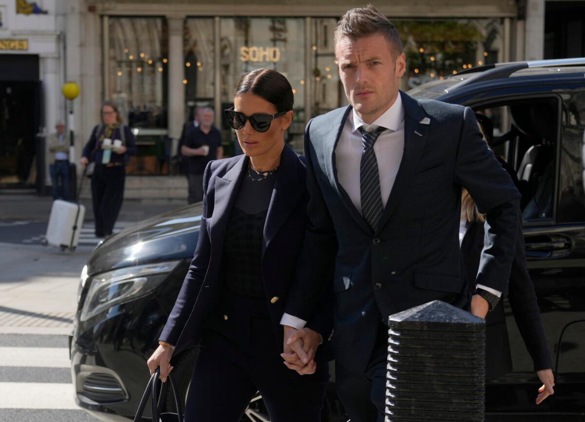 Leicester City and England soccer player Jamie Vardy and his wife Rebekah Vardy arrive together at the High Court in London on May 17, 2022. (Alastair Grant/AP Photo)