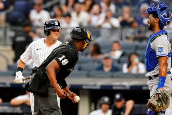 New York Yankees' Andrew Benintendi, left, talks to Kansas City Royals catcher MJ Melendez, right, during the first inning of a baseball game Thursday, July 28, 2022, in New York. (Frank Franklin II/AP Photo)