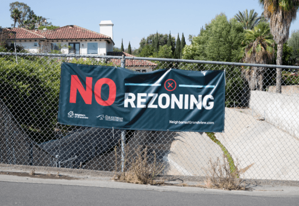 A sign hangs in opposition to a proposed location city officials are considering to zone for housing in Yorba Linda, Calif., on July 27, 2022. (John Fredricks/The Epoch Times)