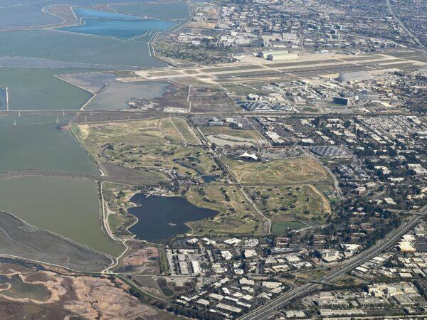 An aerial shot of Shoreline Lake and the surrounding estuaries. Shoreline Lake is the dark blue body of water near the front of the photo. (Courtesy of Karen Gough)