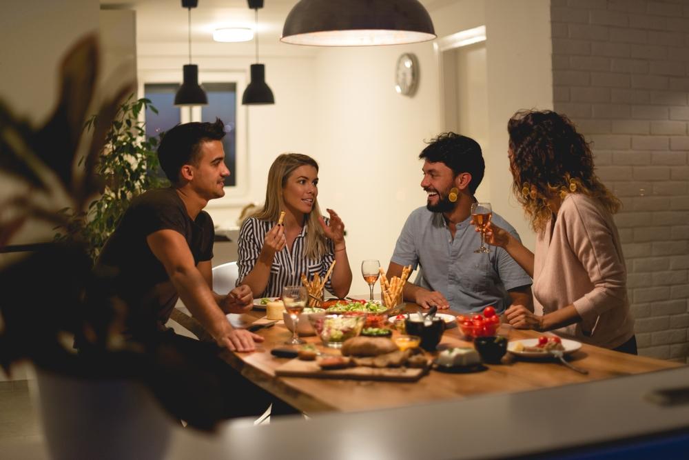 Pot-luck dinners are an ideal way to vary the diet, lift the spirits, and deepen relationships. (Stock Rocket/Shutterstock)