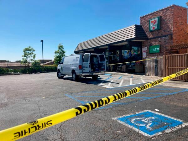 Police investigate a shooting at a 7-Eleven store in Brea, Calif., on July 11, 2022. (Eugene Garcia/AP Photo)
