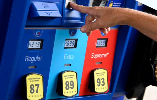 A person uses the keypad on a pump at a gas station in Arlington, Va., on July 29, 2022. (Olivier Douliery/AFP via Getty Images)