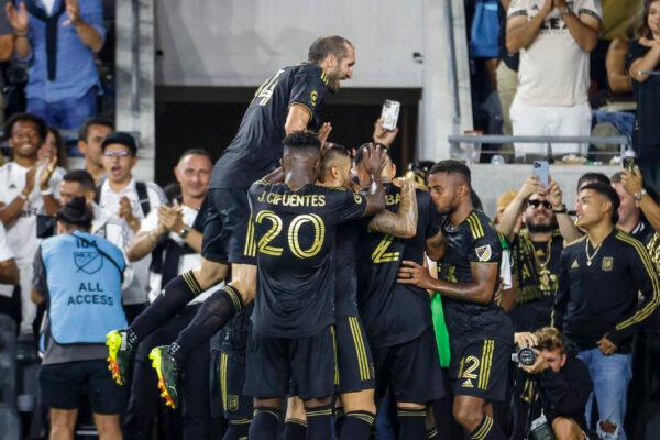 Los Angeles FC defender Giorgio Chiellini jumps to celebrate with teammates after forward Kwadwo Opoku scored against the Seattle Sounders during the first half of an MLS soccer match in Los Angeles on July 29, 2022. (Ringo H.W. Chiu/AP Photo)