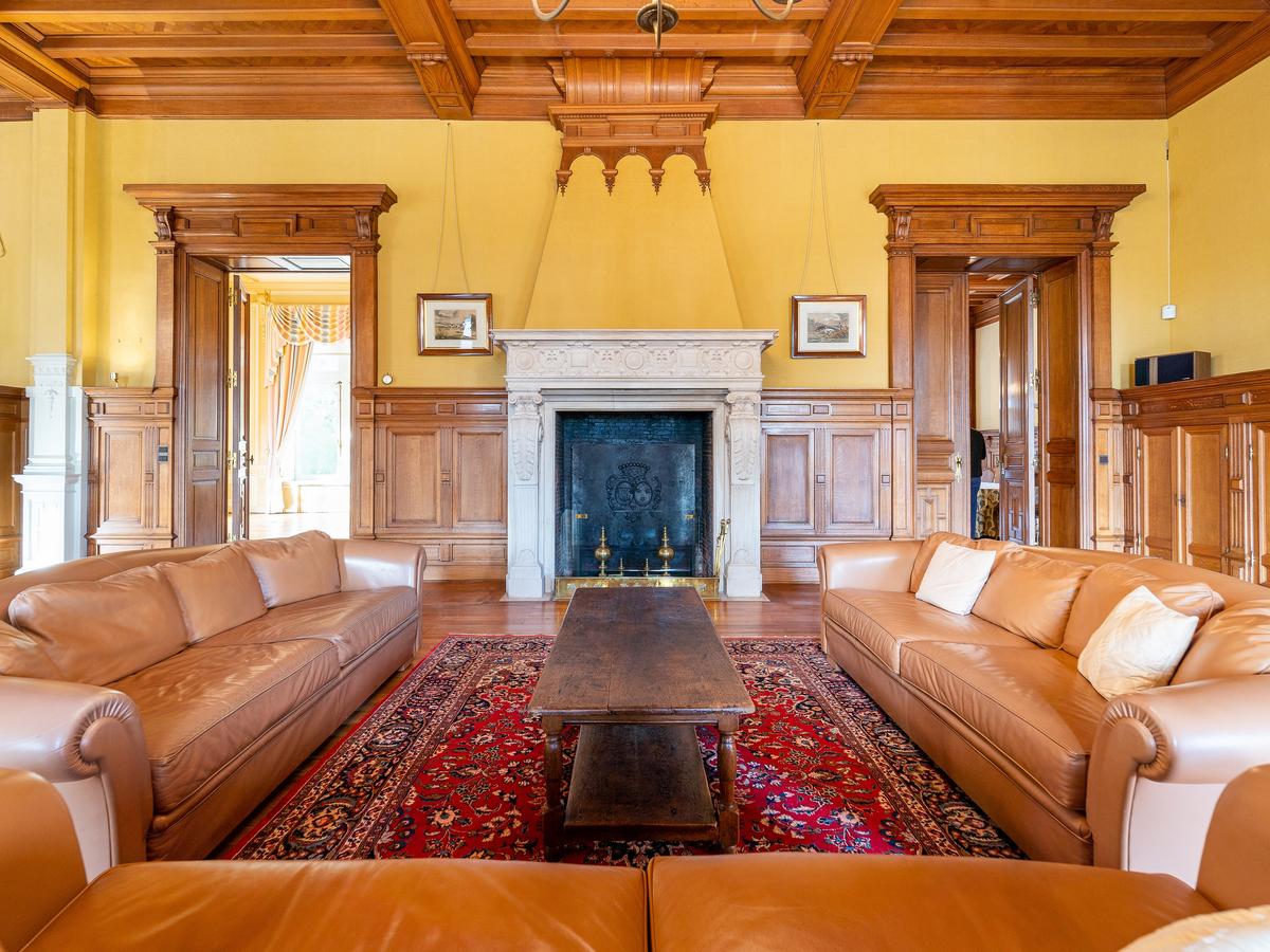 Rich paneling, towering doorways, brilliant millwork, and other luxurious touches provide a royal feel throughout the castle. (Courtesy of Belgium Sotheby’s International Realty)