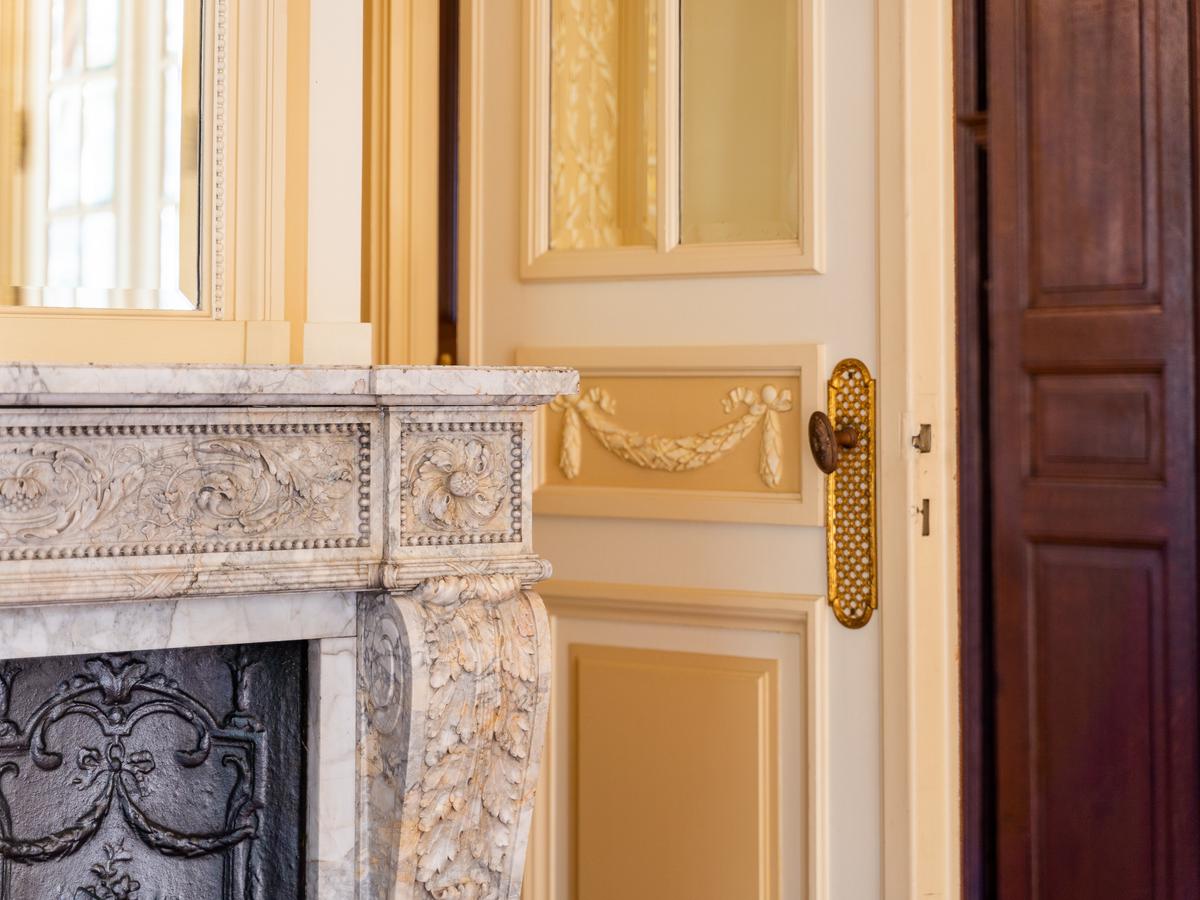 A hand carved marble fireplace and other touches are evidence of the uncompromising attention to detail that went into the design and construction of Château d'Ostemerée. (Courtesy of Belgium Sotheby’s International Realty)