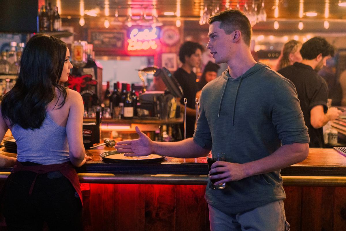 Cassie (Sophia Carson) and Luke (Nicholas Galitzine) definitely don't "meet cute," in "Purple Hearts." (Netflix)
