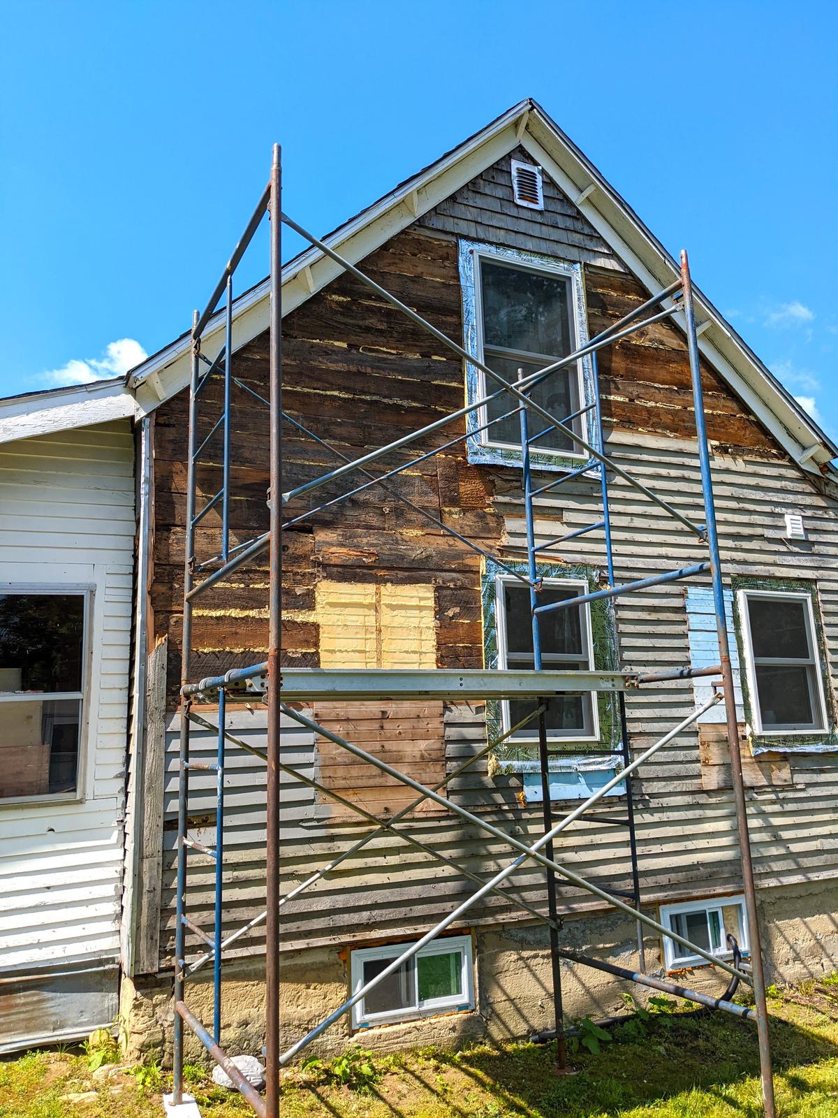 Safe pipe scaffolding is allowing these homeowners to remove old wood siding and install new vinyl siding themselves. They'll save many thousands of dollars. (Tim Carter/TNS)
