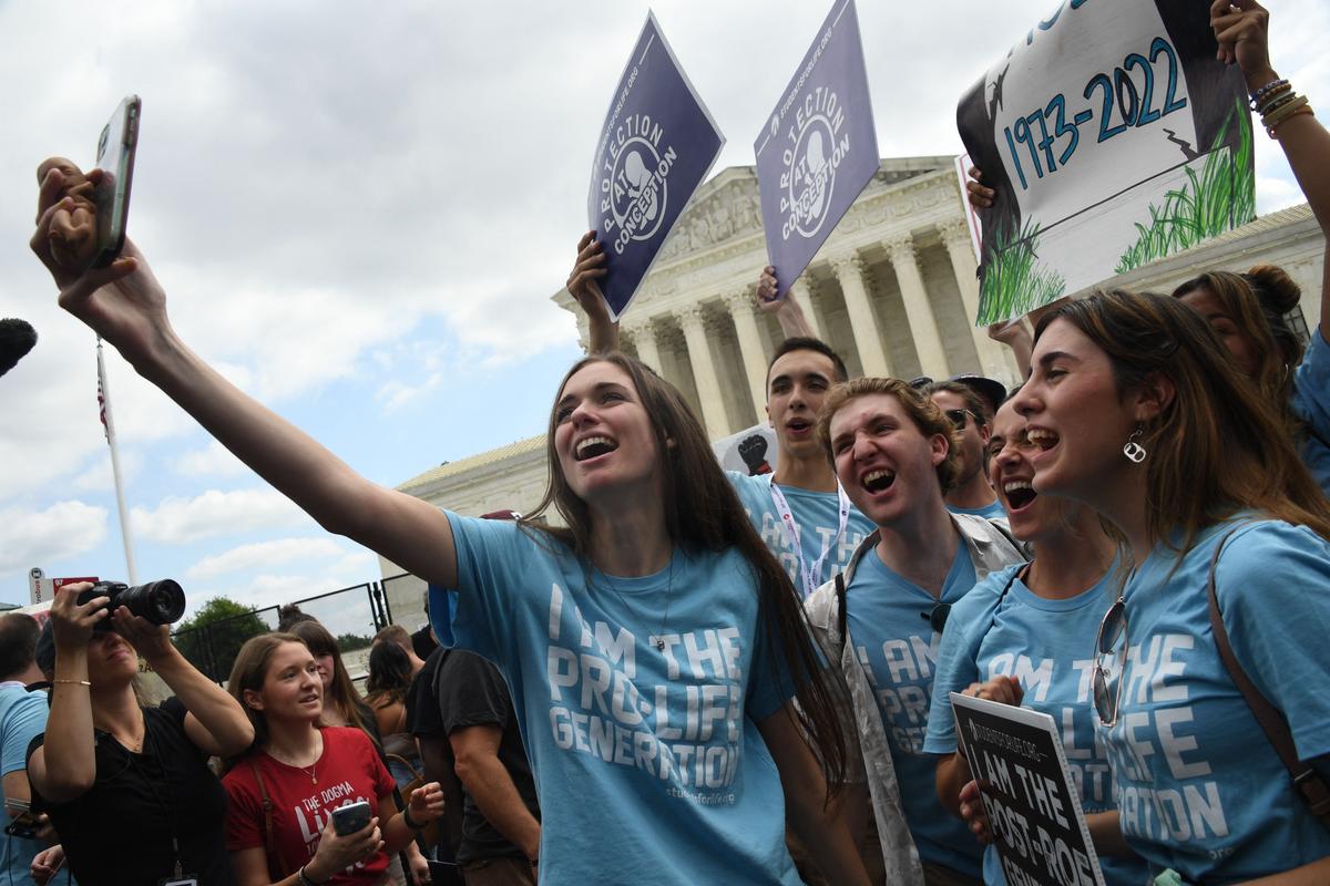 Pro-life supporters celebrate outside the U.S. Supreme Court in Washington, DC, on June 24, 2022, after the overturning of Roe v Wade. (Oliver Douliery/AFP via Getty Images)