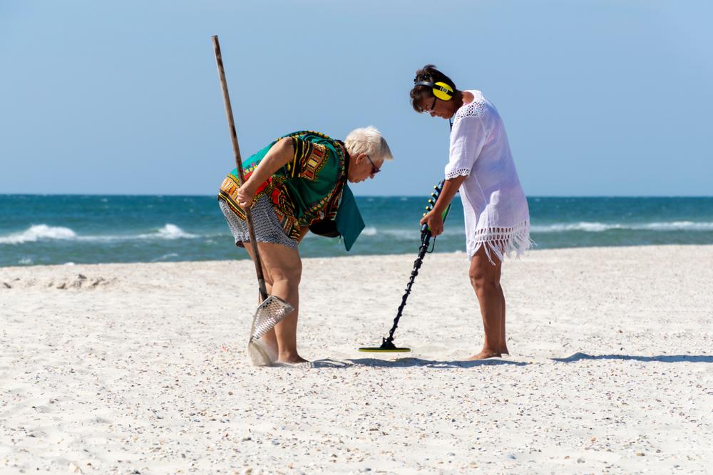 Treasure hunters searching beaches with metal detectors get a tan while finding lost jewelry and sometimes items washed up from offshore shipwrecks. (ForGaby/Shutterstock)