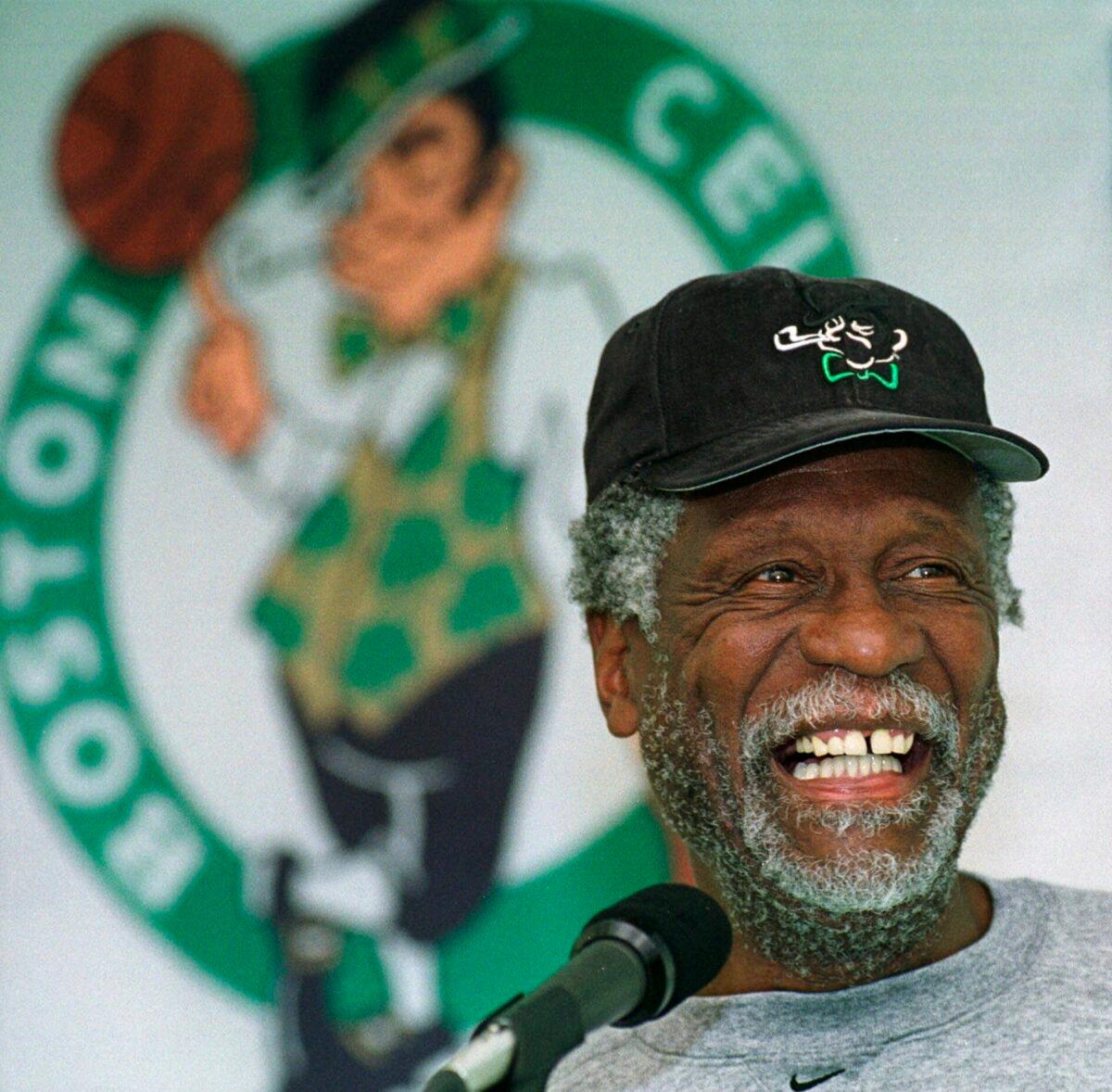 Boston Celtics legendary center Bill Russell has a light moment while answering questions from members of the media after a Celtics team practice in Waltham, Mass., on Oct. 11, 1999. (Angela Rowlings/AP Photo)