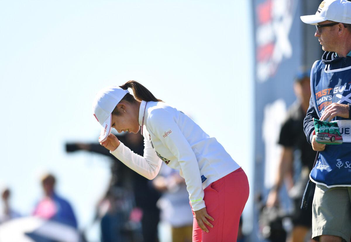 Ayaka Furue of Japan bows as she finishes her round at the 18th green during the final round of the Trust Golf Women's Scottish Open at Dundonald Links Golf Course in Troon, Scotland, on July 31, 2022. (Mark Runnacles/Getty Images)
