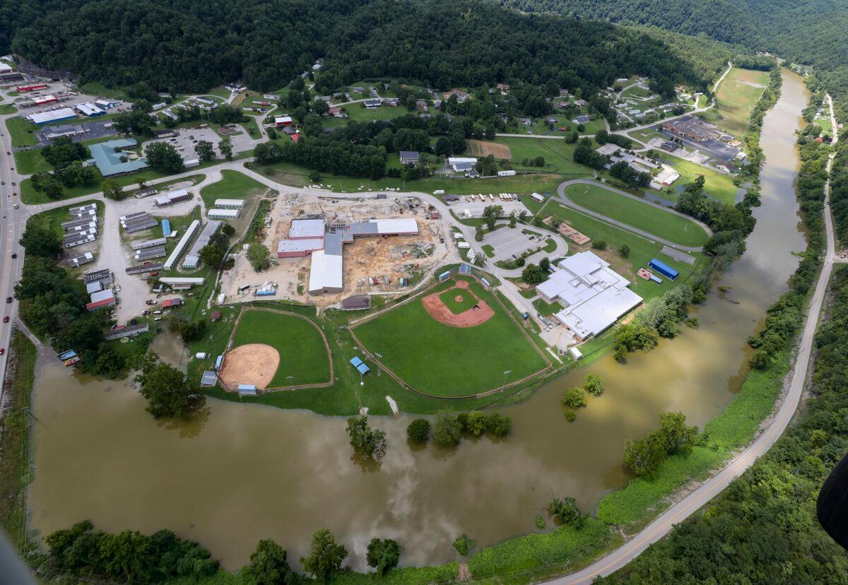 In this aerial image, the river is still high around the homes in Breathitt County, Ky., on July 30, 2022. (Michael Clevenger/Courier Journal via AP)