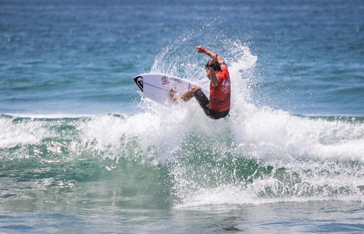 A surfer competes on the opening day of the Vans US Open of Surfing in Huntington Beach, Calif., on July 30, 2022. (John Fredricks/The Epoch Times)
