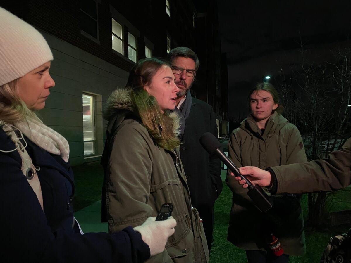 Clint Thomas, his wife, and one of his daughters speak to reporters outside the Loudoun County Public Schools administration building in Ashburn, Va., on Jan. 25, 2022. (Terri Wu/The Epoch Times)