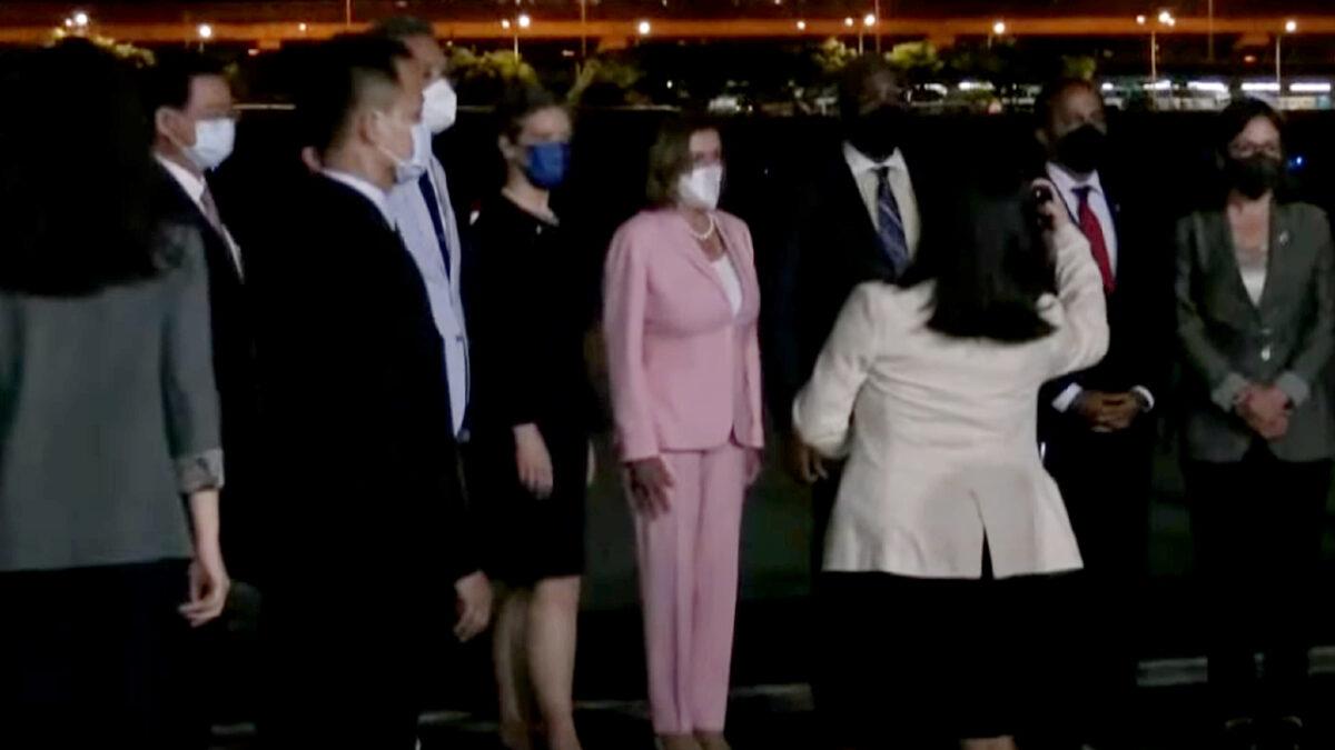 U.S. House Speaker Nancy Pelosi (C) arrives in Songshan Airport in Taipei, Taiwan, on Aug. 2, 2022, in a still from video. (Taiwan Foreign Ministry, Pool via Reuters/Screenshot via NTD)