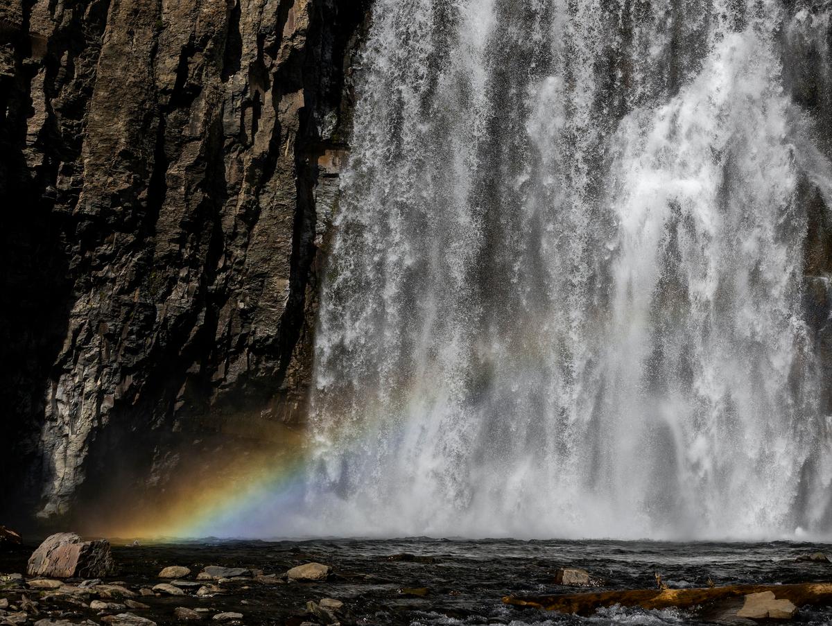 A rainbow forms in the mist as the water cascades down Rainbow Falls National Monument near Red's Meadow on June 21, 2022. (Allen J. Schaben Los Angeles Times/TNS)