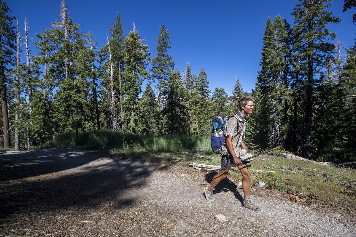 A hiker travels the Pacific Crest Trail to Red's Meadow Resort & Pack Station on June 21, 2022, in Mammoth Lakes, California. (Allen J. Schaben/Los Angeles Times/TNS)