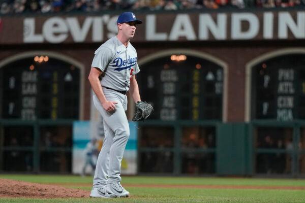 Los Angeles Dodgers pitcher Evan Phillips reacts after striking out San Francisco Giants' Austin Slater to retire the Giants during the sixth inning in relief with bases loaded of a baseball game in San Francisco, Tuesday, Aug. 2, 2022. (Jeff Chiu/AP Photo)