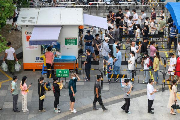 Residents queue to undergo PCR testing for COVID-19 at a swab collection site in Guangzhou, in China's southern Guangdong Province in August 2022. (STR/AFP via Getty Images)