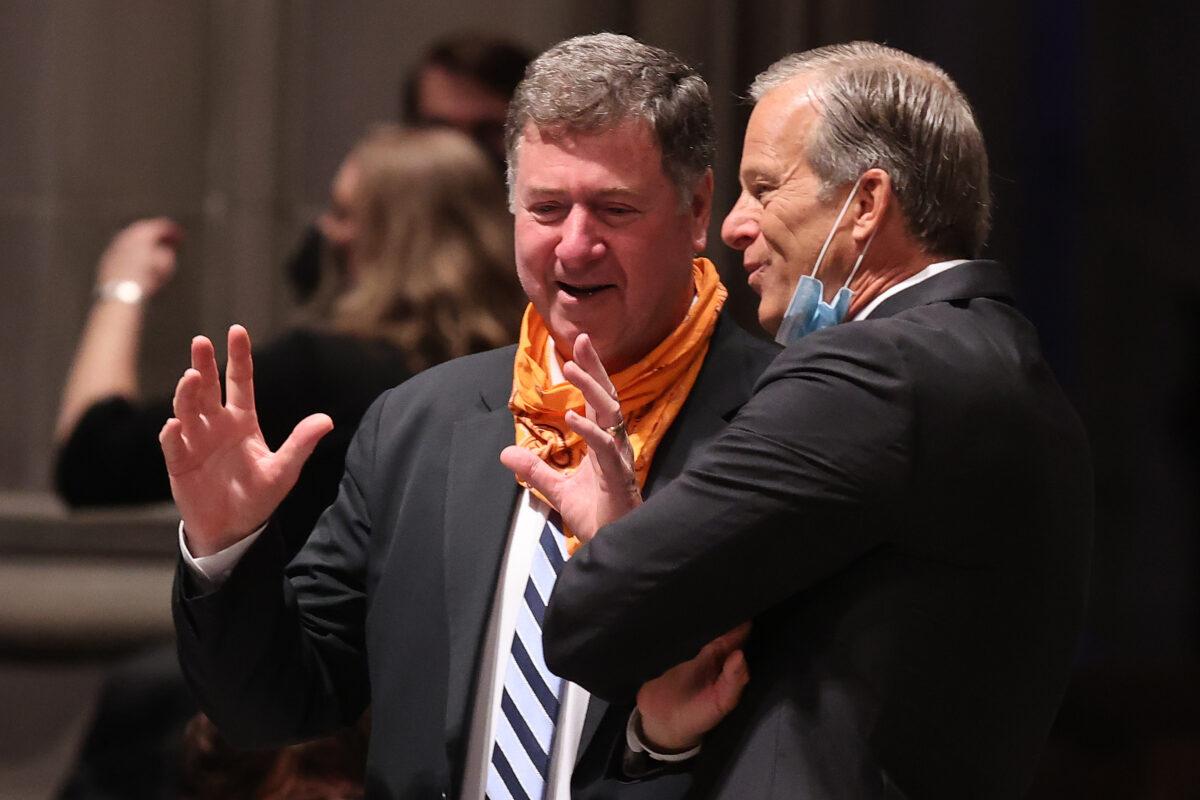 Former Virginia governor and Sen. George Allen (L) talks with Sen. John Thune (R-S.D.) before the funeral service for former Sen. John Warner (R-Va.) at the National Cathedral in Washington, on June 23, 2021. (Chip Somodevilla/Getty Images)