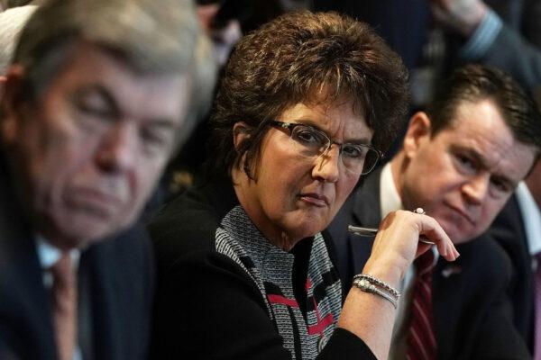 (L-R) U.S. Sen. Roy Blunt (R-Mo.), Rep. Jackie Walorski (R-Ind.), and Sen. Todd Young (R-Ind.) listen during a meeting between President Donald Trump and congressional members in the Cabinet Room of the White House in Washington on Feb. 13, 2018. (Alex Wong/Getty Images)