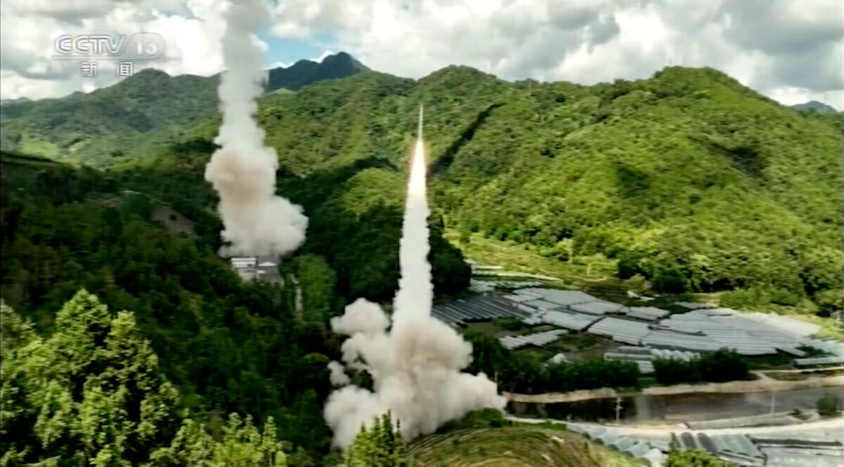 A missile is launched from an unspecified location in China on Aug. 4, 2022. The Chinese military fired live missiles into waters near Taiwan as part of its planned exercises on Aug. 4. (CCTV via AP)