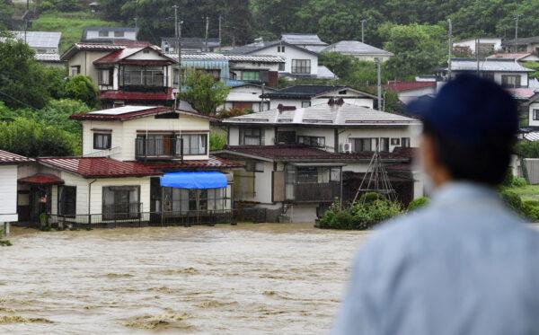 Submerged houses were caused by a flood in Oe town, Yamagata prefecture, Japan on Aug. 4, 2022. (Kyodo/Reuters)