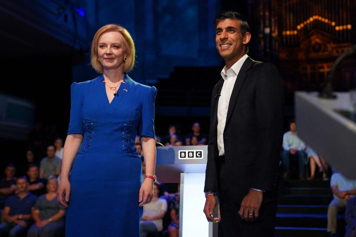 Britain's Foreign Secretary Liz Truss (L) and former Chancellor of the Exchequer Rishi Sunak, contenders to become the country's next prime minister, arrive to take part in the BBC's "The UK's Next Prime Minister: The Debate" in Victoria Hall in Stoke-on-Trent, central England, on July 25, 2022. (Jacob King/Pool/AFP via Getty Images)